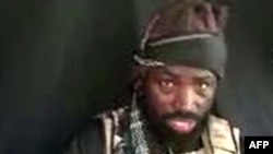 FILE - This screen grab image taken on Sep. 25, 2016, from a video released on Youtube by Boko Haram shows the Islamist group's leader Abubakar Shekau making a statement at an undisclosed location. 