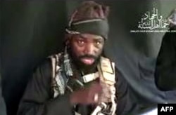 This screen grab image taken on September 25, 2016 from a video released on Youtube by Islamist group Boko Haram shows Boko Haram leader Abubakar Shekau making a statement at an undisclosed location.