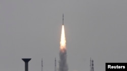 FILE - India's Polar Satellite Launch Vehicle (PSLV-C23), carrying five satellites, lifts off from the Satish Dhawan Space Centre in Sriharikota, north of the southern Indian city of Chennai, June 30, 2014. The more recent launch of the Polar Satellite Launch Vehicle (PSLV) C-34 carried 17 foreign and three domestic satellites.