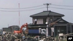 In Miyagi Prefecture alone, authorities estimate they will collect around 18 million metric tons of debris. Workers continue clearing debris in July, 2011