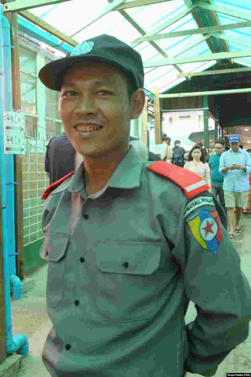 One of the 40,000 ordinary citizens drafted as &quot;special police&quot; to help provide security at polling stations on election day in Yangon, Nov. 8, 2015.