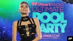 Miley Cyrus hosts the iHeartRadio Ultimate Pool Party at the Fontainebleau Hotel, June 29, 2013 in Miami.