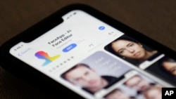 FaceApp is displayed on an iPhone Wednesday, July 17, 2019, in New York. The popular app is under fire for privacy concerns. (AP Photo/Jenny Kane)