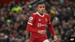 FILE- Manchester United's Mason Greenwood runs during an English Premier League soccer match between Manchester United and Burnley, at Old Trafford in Manchester, England, Dec. 30, 2021. 