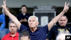 Former campaign adviser for President Donald Trump, Roger Stone walks out of the federal courthouse following a hearing, Jan. 25, 2019, in Fort Lauderdale, Fla.