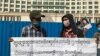 Former employees at the Great Duke Hotel protest in front of the hotel, demanding compensation from the hotel's owner, Phnom Penh, Cambodia, May 21, 2020. (Kann Vicheika/VOA Khmer) 