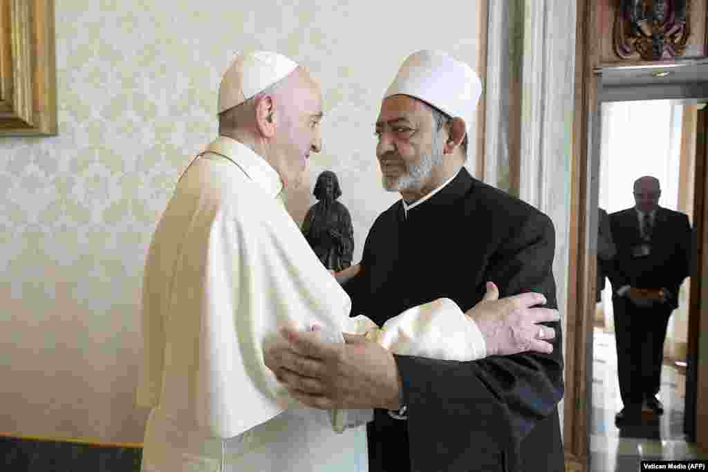 Pope Francis (L) greets Egyptian Islamic scholar and the current Grand Imam of al-Azhar mosque, Sheikh Ahmed Al-Tayeb upon his arrival for a private audience at the Vatican.