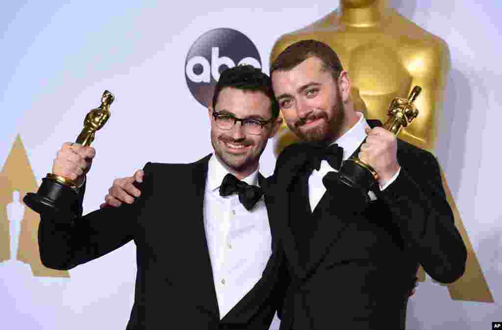 Jimmy Napes, left, and Sam Smith pose in the press room with the award for best original song for “Writing’s On The Wall” from “Spectre” at the Oscars on Feb. 28, 2016, at the Dolby Theatre in Los Angeles. 