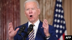 (FILES) In this file photo US President Joe Biden speaks about foreign policy at the State Department in Washington, DC, on February 4, 2021. - US President Joe Biden said he won't lift sanctions against Iran as long as the Islamic republic is not adherin