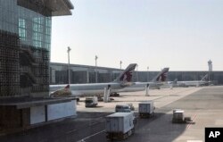 Qatar Airways planes are seen parked at the Hamad International Airport in Doha, Qatar, June 16, 2017.