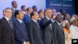 FILE - President Barack Obama waves during the official family photo at the U.S.-African Leaders Summit at the State Department in Washington, Aug. 6, 2014.