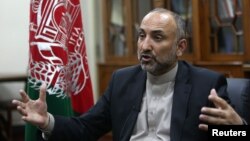 In this Oct. 24, 2015, photo, Afghan National Security Adviser Mohammad Hanif Atmar speaks with The Associated Press, in Kabul, Afghanistan. 