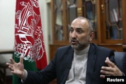 FILE - Then-Afghan National Security Adviser Mohammad Hanif Atmar speaks with The Associated Press, in Kabul, Afghanistan, Oct. 24, 2015.