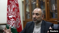 FILE - Afghan National Security Adviser Hanif Atmar speaks with The Associated Press, in Kabul, Afghanistan, Oct. 24, 2015.