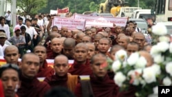 Burmese Buddhist monks march through streets in Rangoon, Burma, October 8, 2012. 
