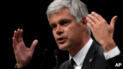 FILE - Laurent Wauquiez, President of the Republican Party, delivers his speech during a campaign meeting in Marseille, southern France, May 6, 2019. 