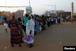People stand in line during the Panafrican Film and Television Festival (FESPACO) in Ouagadougou, Burkina Faso, March 3, 2017.