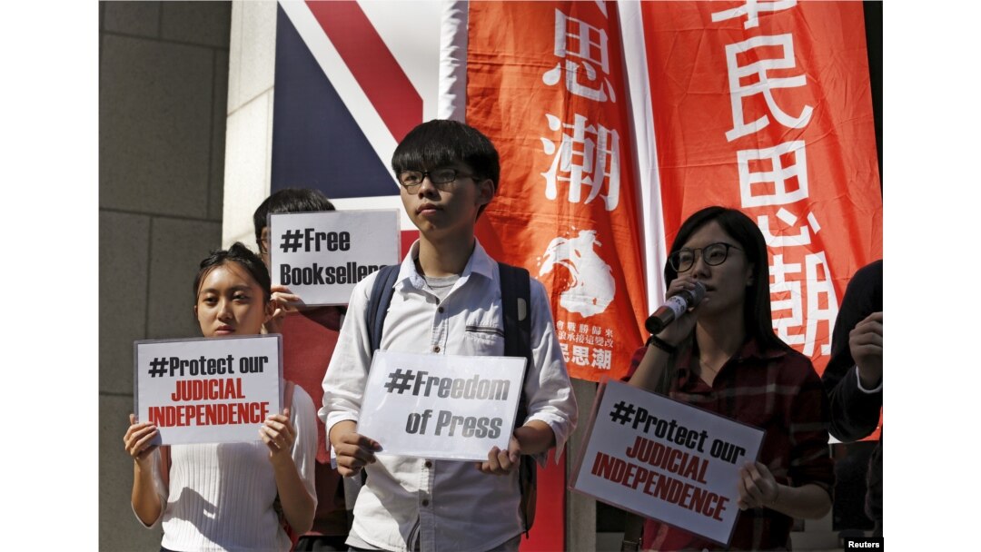 FILE - Members of student group Scholarism protest the disappearance of booksellers outside the British consulate in Hong Kong, Jan. 6, 2016.