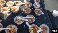 A few of the unusual foods available at the West Virginia Roadkill Cook-off. (Phil Dierking/VOA)