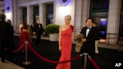 FILE - Adviser Kellyanne Conway, accompanied by her husband, George, arrive for a dinner at Union Station in Washington, Jan. 19, 2017, a day before Donald Trump's inauguration.