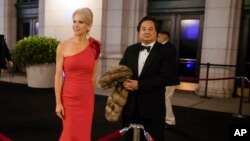 FILE - Adviser Kellyanne Conway, accompanied by her husband, George, arrive for a dinner at Union Station in Washington, Jan. 19, 2017, a day before Donald Trump's inauguration.
