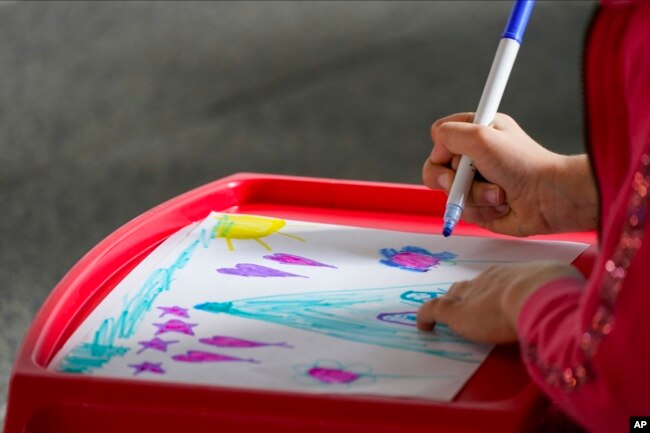 Students from Public School 11 take part in art and science classes at the High Line Park Wednesday, Oct. 21, 2020, in New York. (AP Photo/Frank Franklin II)