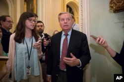 South Carolina Senator Lindsey Graham talks to reporters at the U.S. Capitol.