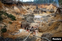 FILE - An illegal mine is seen in the southern Venezuela state of Bolivar near the border with Brazil Nov. 17, 2012.