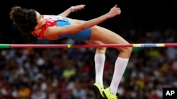 FILE - Russia's Anna Chicherova competes in the women's high jump final at the World Athletics Championships at the Bird's Nest stadium in Beijing, Aug. 29, 2015. 