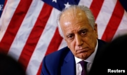 FILE - U.S. special envoy for peace in Afghanistan, Zalmay Khalilzad, talks with local reporters at the U.S. Embassy in Kabul, Afghanistan, Nov. 18, 2018.