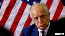 FILE - U.S. special envoy for peace in Afghanistan, Zalmay Khalilzad, talks with local reporters at the U.S. embassy in Kabul, Afghanistan, Nov. 18, 2018.