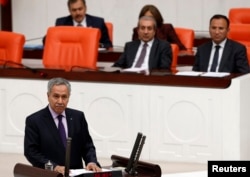 FILE -Turkey's Deputy Prime Minister Bulent Arinc addresses the Turkish Parliament in Ankara, Oct. 31, 2013.