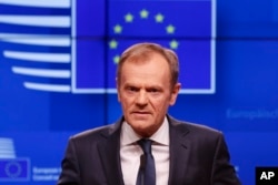 FILE - European Council President Donald Tusk speaks during a media conference on Brexit at the Europa building in Brussels, March 20, 2019.