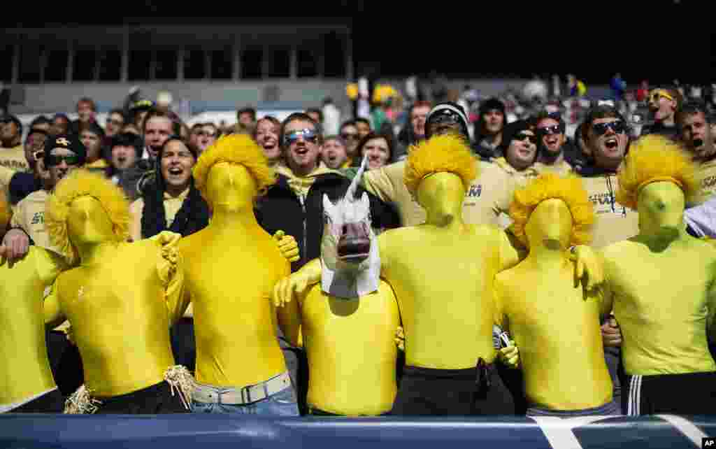 Georgia Tech fans sing a school song before the start of an NCAA college football game against Clemson, Nov. 15, 2014, in Atlanta.