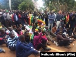 Supporters of Pastor Evan Mawarire demonstrate outside a Harare Court.