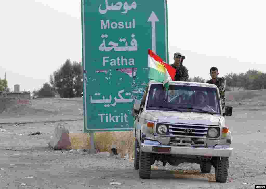 Members of the Kurdish security forces take part in an intensive security deployment on the outskirts of Kirkuk, June 12, 2014. &nbsp;