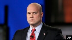 FILE - Then-Senate candidate Matt Whitaker is pictured before a televised debate in Johnston, Iowa, April 24, 2014. 