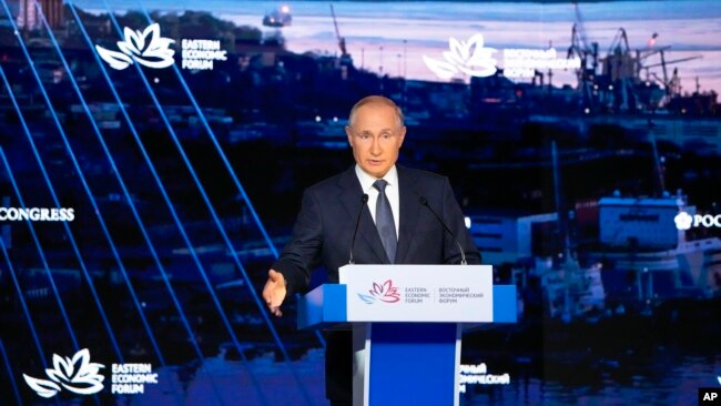 FILE - Russian President Vladimir Putin gestures as he delivers a speech during a plenary session at the Eastern Economic Forum, in Vladivostok, Russia, Sept. 3, 2021.