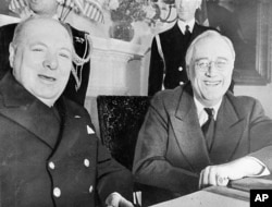 Prime Minister Winston Churchill of England (left) and President Franklin D. Roosevelt sit at the White House in Washington, D.C., Dec. 22, 1941.