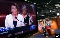 House Minority Leader Nancy Pelosi of California, is shown on television as she speaks from the House floor on Capitol Hill in Washington, Feb. 7, 2018.