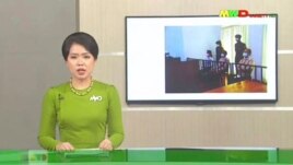 In this image from Myawaddy TV, a photograph of deposed Myanmar leader Aung San Suu Kyi's court appearance was shown during a report about her case is read by a news presenter Monday, May 24, 2021, in Naypyitaw, Myanmar. (Myawaddy TV via AP)