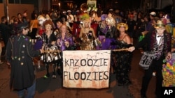 Members of the Krewe du Vieux paraded through the streets of the French Quarter celebrating the Mardi Gras season in New Orleans