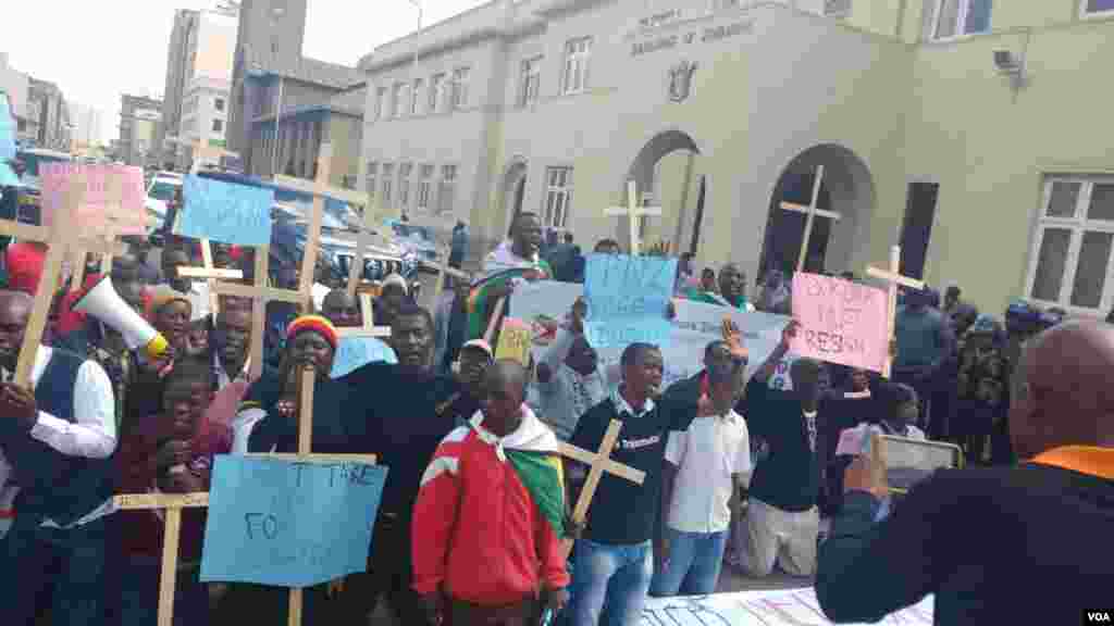 Protesters march in Harare demanding the resignation of Zimbabwe's education minister.