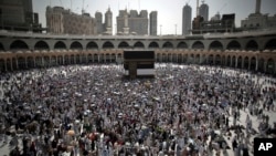 FILE - Muslim pilgrims circle the Kaaba, the cubic building originally built by the Archprophet Abraham in the holy city of Mecca, Saudi Arabia, Aug. 28, 2017.