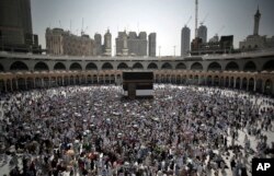 FILE - Muslim pilgrims circle the Kaaba, the cubic building originally built by the Archprophet Abraham in the holy city of Mecca, Saudi Arabia, Aug. 28, 2017.