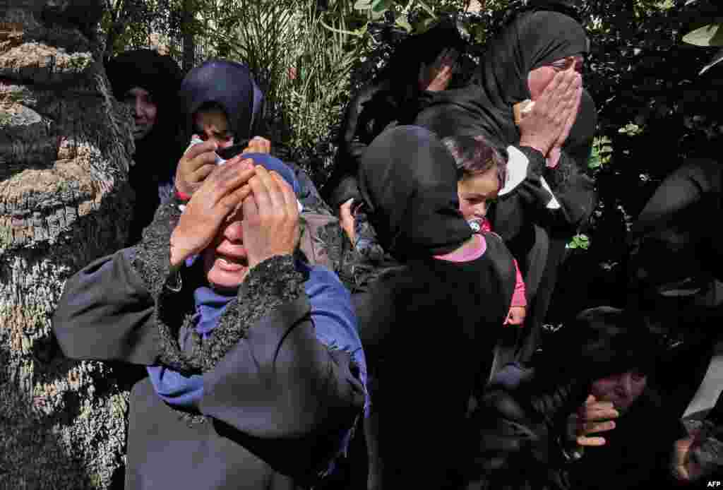 Relatives of 27-year-old Palestinian farmer Omar Samour, who was killed earlier in the day by Israeli tank fire, mourn during a funerary procession in Khan Yunis in the southern Gaza strip.