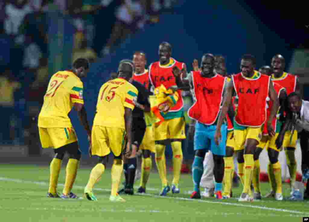 Mali's Bakaye Traore celebrates his goal with teammates during their African Nations Cup Group D soccer match against Guinea at Franceville Stadium