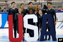 Nominees to the Olympic team, including Maame Biney (front row center), pose for a photo after the U.S. Olympic short track speedskating trials, Dec. 17, 2017, in Kearns, Utah.