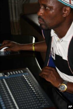 Madlingozi concentrates as he tries to perfect a mix on a new song in his studio in Johannesburg