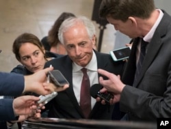 FILE - Senate Foreign Relations Committee Chairman Sen. Bob Corker, R-Tenn. is surrounded by reporters on Capitol Hill in Washington, May 16, 2017.